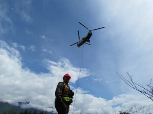 forest worker with helicopter